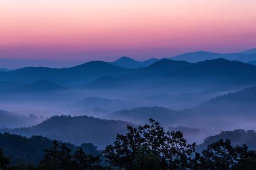 a view of a mountain range at sunset at Relaxing Escape Pool Access & Close to Dollywood in Pigeon Forge