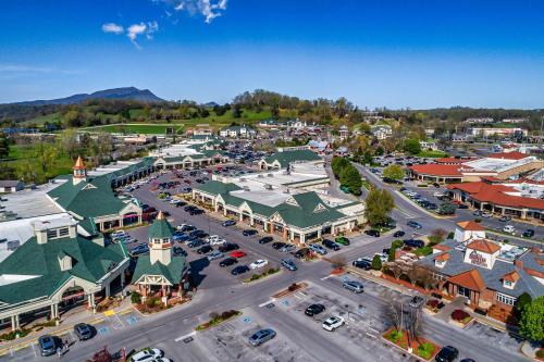 an aerial view of a small town with cars parked at Relaxing Escape Pool Access & Close to Dollywood in Pigeon Forge