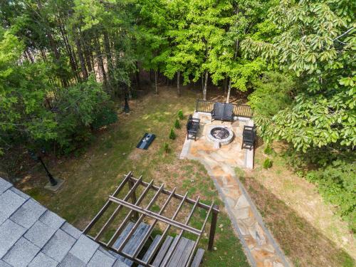 an aerial view of a backyard with a fence and a grill at Cozy Retreat awaits w Pool Grill Near Dollywood in Pigeon Forge