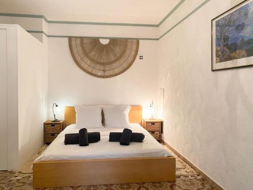 a bedroom with a large bed with two night stands at Large Family Home in Mediterranean France in Tourbes