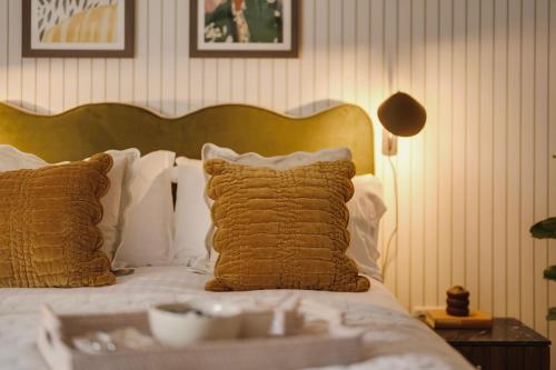 a bed with pillows and a tray with a bowl on it at Hotwells I Your Apartment in Bristol