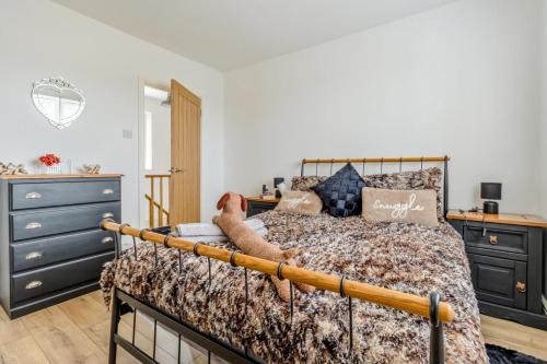 a bedroom with a bed and a dresser at 3 Bed in Forden oc-c30173 in Forden
