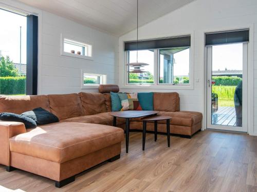 a living room with a couch and a table at 5 star holiday home in Hejls in Hejls