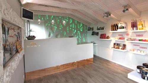 a store with a white counter in a room at Casas Ordesa y Casa Altemir in Belsierre