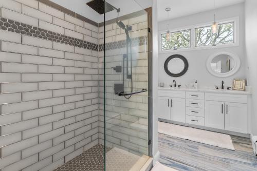 a bathroom with a shower and a sink at Water View Home with Hot Tub Balcony Pool and Tennis in Mashpee