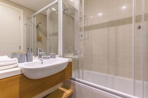 a bathroom with a sink and a shower at Aluma 2-BR Apt & Balcony at Waterfront Dbayeh in Dbayeh