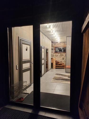 a view of a hallway through a glass door at Talu villa 