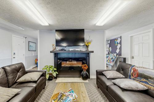 a living room with two couches and a fireplace at Wellington Manor 240 in Wells