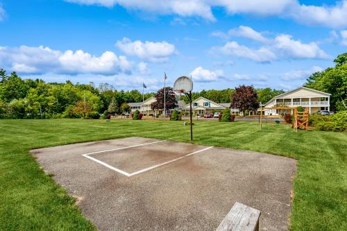 a basketball court in a field with a basketball hoop at Wellington Manor 240 in Wells
