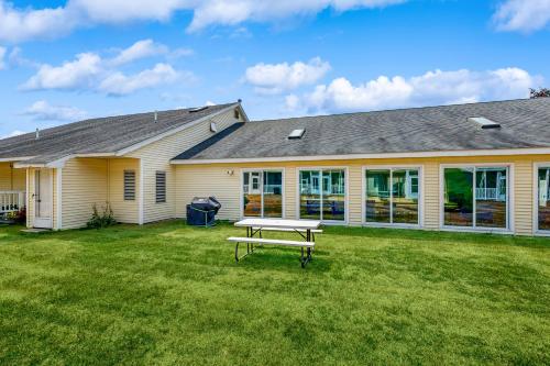 a house with a picnic table in the yard at Wellington Manor 240 in Wells