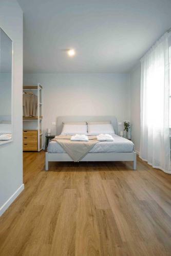 Postel nebo postele na pokoji v ubytování La Croce Apartments