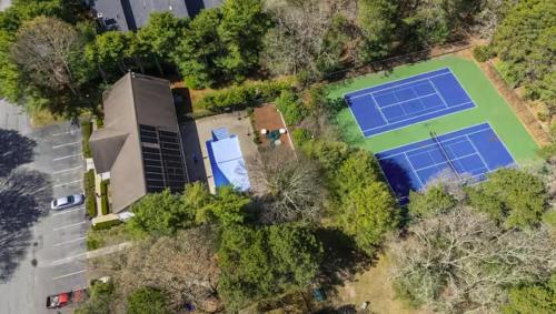 an aerial view of a tennis court with two large tennis courts at Water View Home with Hot Tub Balcony Pool and Tennis in Mashpee