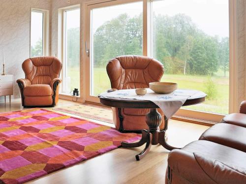 a living room with two chairs and a coffee table at 5 person holiday home in LJUNGSKILE-By Traum in Ljungskile