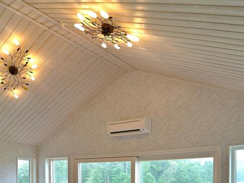 a ceiling with two chandeliers and a air conditioner at 5 person holiday home in LJUNGSKILE-By Traum in Ljungskile