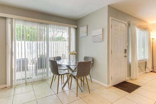 a dining room with a table and chairs and a window at Steps to Park Dog-Friendly Condo in Conyers! in Conyers