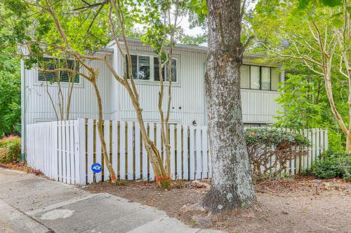 a white fence in front of a house at Steps to Park Dog-Friendly Condo in Conyers! in Conyers