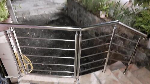 a metal grill on top of some stairs at Angel's Appt in Rivière Noire