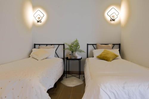 Ένα ή περισσότερα κρεβάτια σε δωμάτιο στο R&K Apartment Madrid