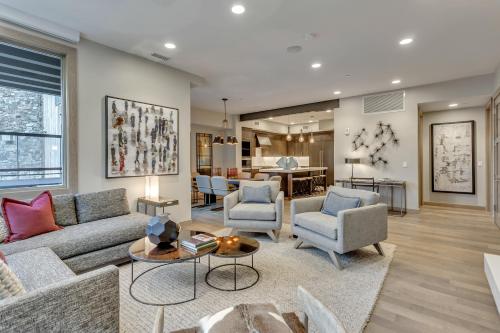 a living room with a couch and chairs at Stein Eriksen Residences in Park City