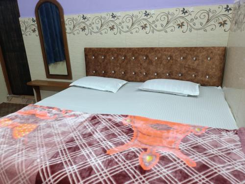 a large bed in a room with a bed sidx sidx sidx at Xavier's guesthouse Wi-Fi and Villa in Colva