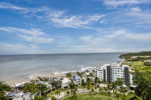 an aerial view of a resort and the beach at 2br Apartamento con Vista al Mar Ph Rio Mar T1-11A in San Carlos