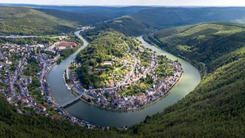 an aerial view of a town next to a river at Lumineux et rénové studio en centre ville in Givet
