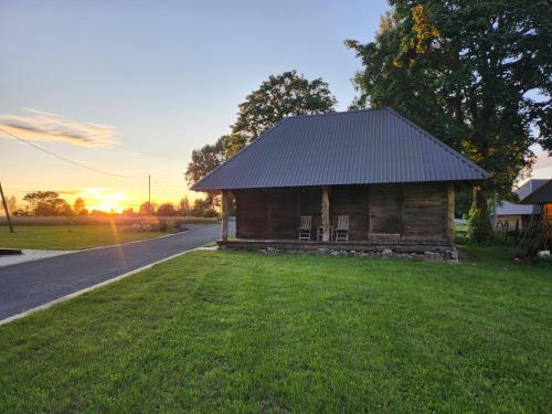 a small wooden cabin on the side of a road at Talu villa 