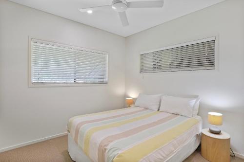 Una cama o camas en una habitación de Amiri Amity Point