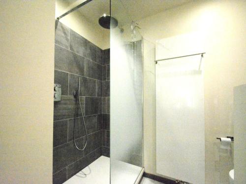 a bathroom with a shower with a glass door at Riverside Villa in Bouillon in Bouillon