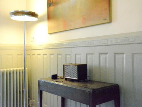 a small television sitting on a table in a room at Riverside Villa in Bouillon in Bouillon