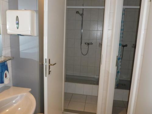 a bathroom with a shower and a sink at Hotel Restaurant Schiff in Möhlin