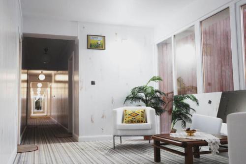 a living room with a couch and a table at Centrul 3H in Sub Piatra