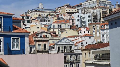a bunch of buildings on top of a hill at Studios with Mezzanine Rua da Moeda in Lisbon