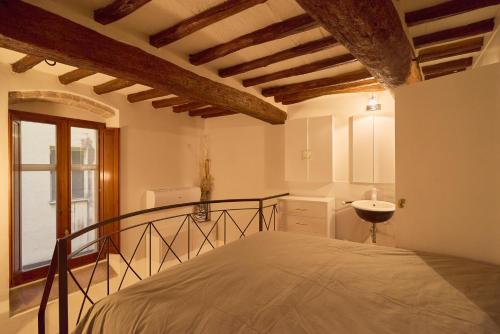 a bedroom with a bed in a room with a window at Suite-La Danzetta in Perugia