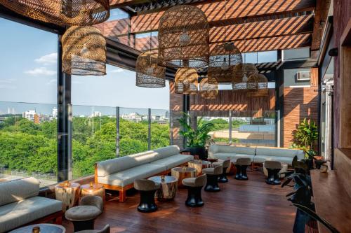 a lobby with couches and chairs and large windows at CODA Williamsburg in Brooklyn