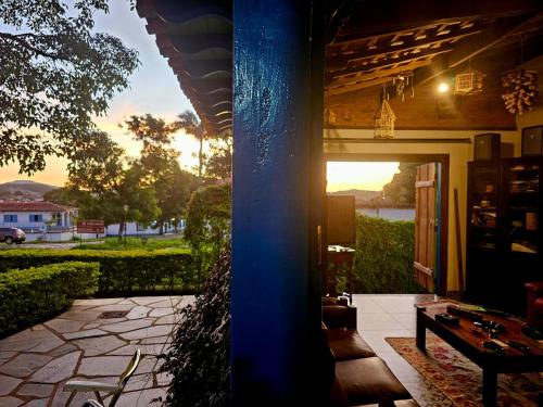 a view of the sunset from a house with a patio at Casa Galeria in Pirenópolis