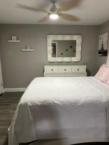 a bedroom with a bed and a ceiling fan at Deland Serenity Place #1 in DeLand
