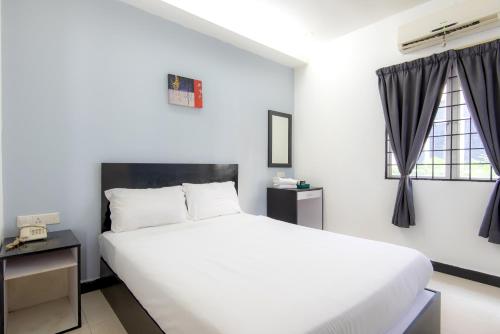 Cama o camas de una habitación en Hotel Pavilion Port
