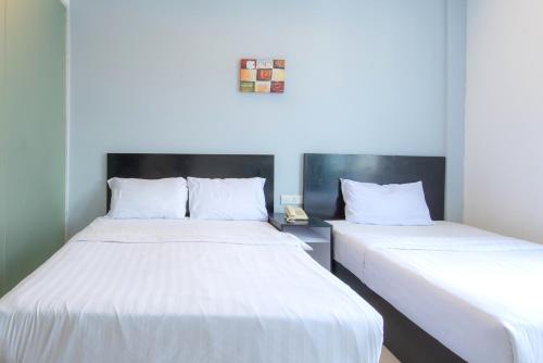 Cama o camas de una habitación en Hotel Pavilion Port