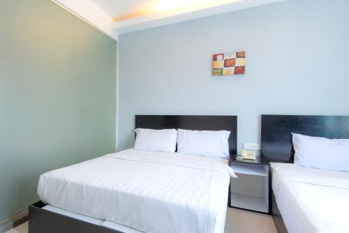 Cama o camas de una habitación en Hotel Pavilion Port