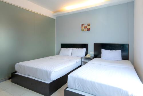 Cama o camas de una habitación en Hotel Pavilion Port