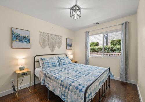 a bedroom with a bed and a window at Cozy&Stylish DT Alhambra Living walk to Starbucks in Alhambra