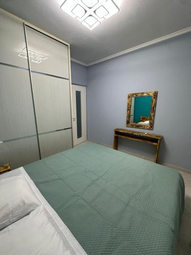 Postel nebo postele na pokoji v ubytování Lilia Apartments