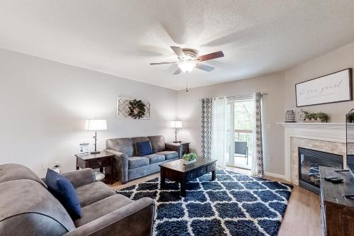 a living room with a couch and a fireplace at Cedar Lodge #503 in Pigeon Forge
