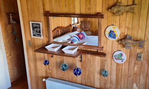 a mirror on the wall of a room at Hostal Boutique El Vergel Azul in Castro