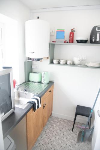 a kitchen with a sink and a counter top at Carrick Central Accommodation in Carrick on Shannon