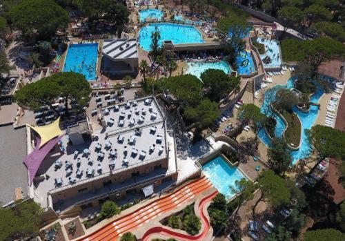 an aerial view of a resort with swimming pools at Mobil home à louer dans camping des cigales le muy 5 étoiles in Le Muy