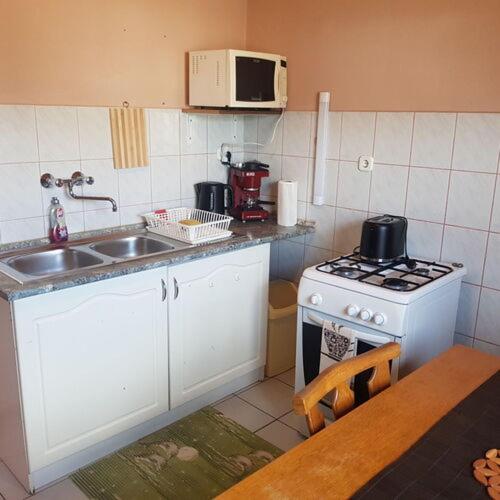 Кухня или мини-кухня в Bagoly Apartman
