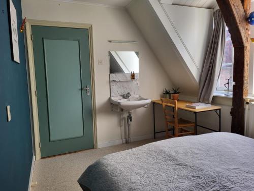 Ένα ή περισσότερα κρεβάτια σε δωμάτιο στο Chambre d'hote à Middelburg