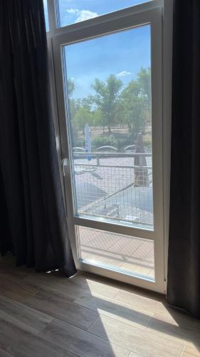 a sliding glass door with a view of a patio at Дача in Kryvyi Rih